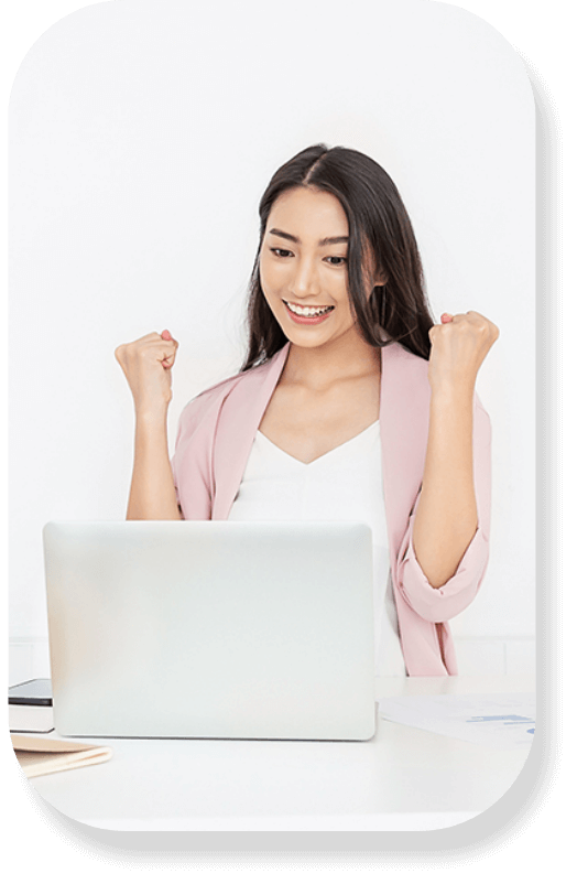 Smiling businesswoman working on a laptop