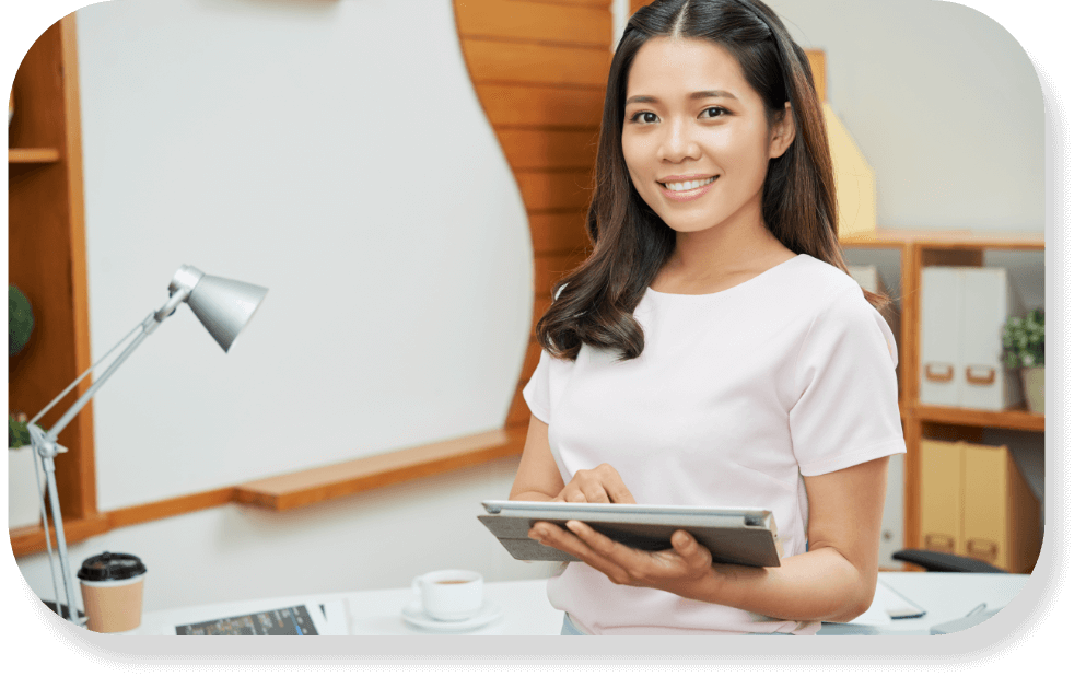 Woman holding a tablet in a modern office setting