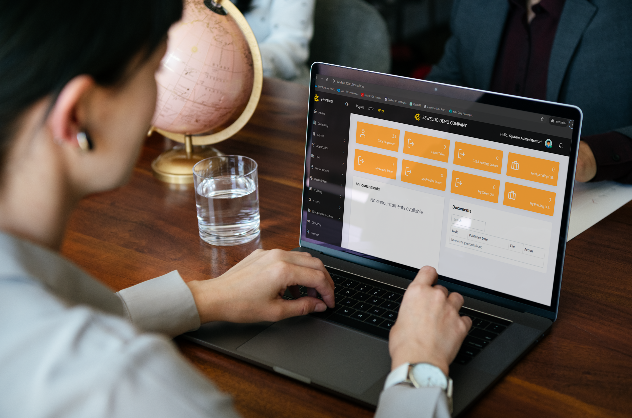 Person working on e-Sweldo interface on laptop